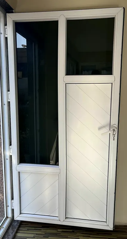 White uPVC door with a panelled leaf, glazed top light and fixed glass side panel